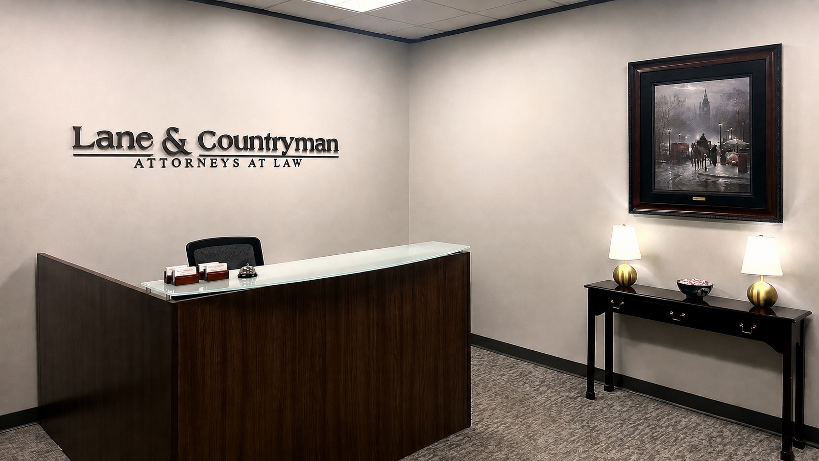Reception area of Lane and Countryman's San Antonio office, with the firm's sign, reception desk, and framed artwork
